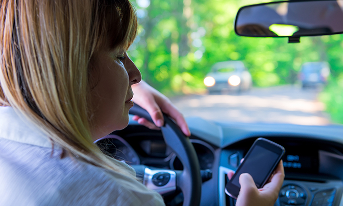 woman driving dangerous on the road