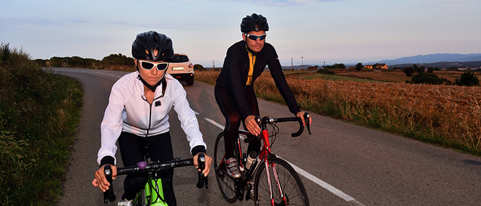 cycling couple on a road